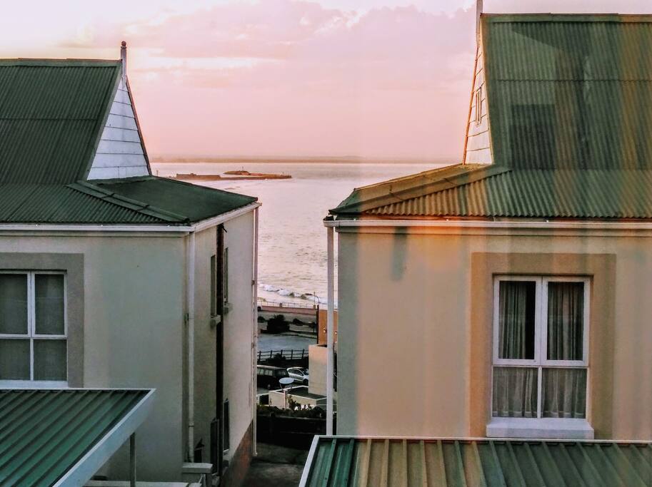 View from the dining room table showing a small but beautiful sea view