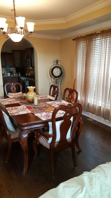 first floor dining table and view into kitchen