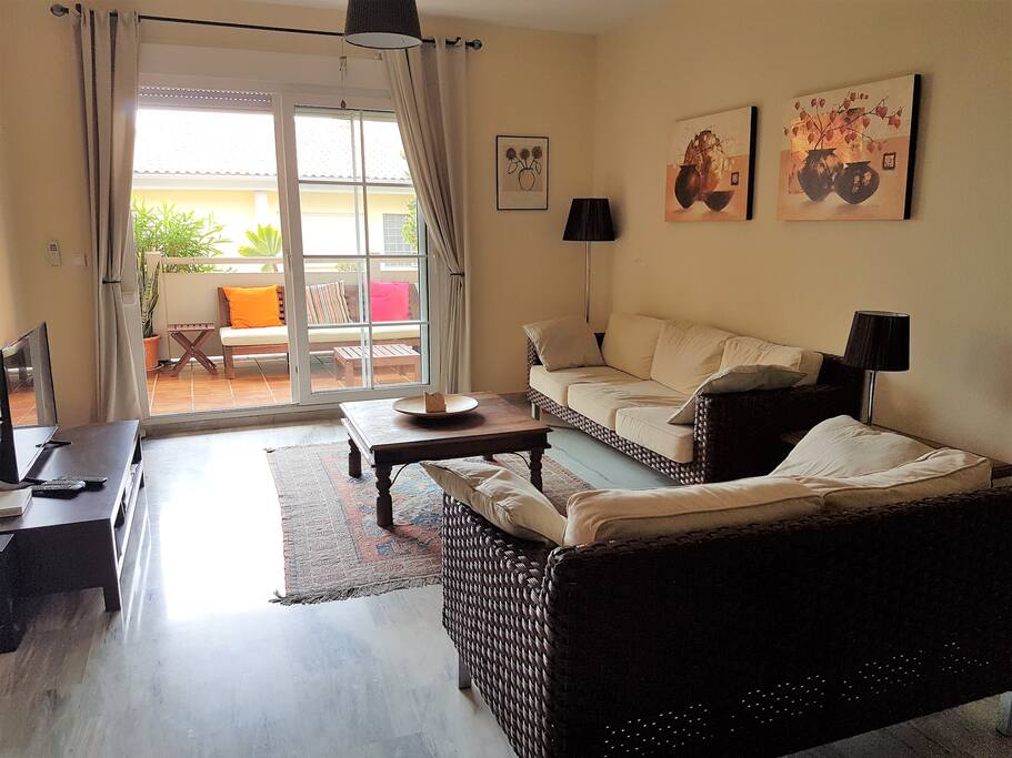 Living area with UK TV, leading to terrace