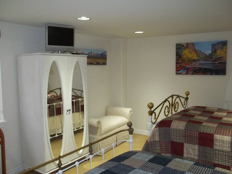 Comfortable “Aspen Bedroom” is well lighted room can sleep 4 people as it has 1 queen size bed with pillow-top mattress, and 1 full double size bed both with extra pillows. Plenty of outdoor light from oversized egress window with privacy shades. Flat screen TV with full array of cable stations. Large closet and chest of drawers.