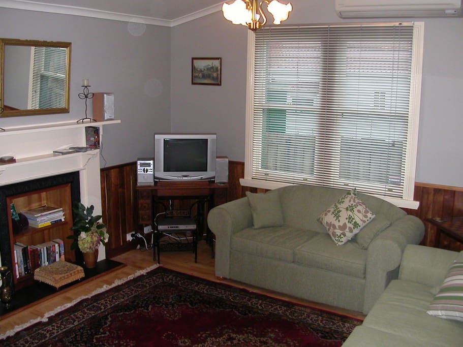 Lounge room has 2 couches (1 is a DB sofa bed). Reverse cycle air conditioner/heater, door to private back yard