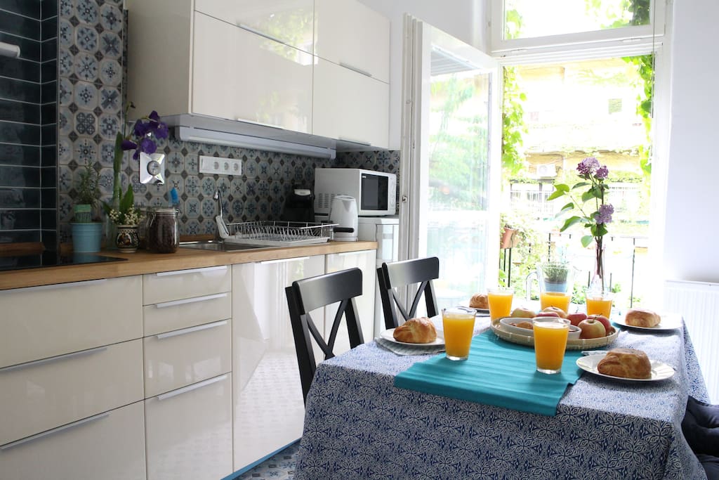kitchen with a small balcony overlooking to our romantic garden