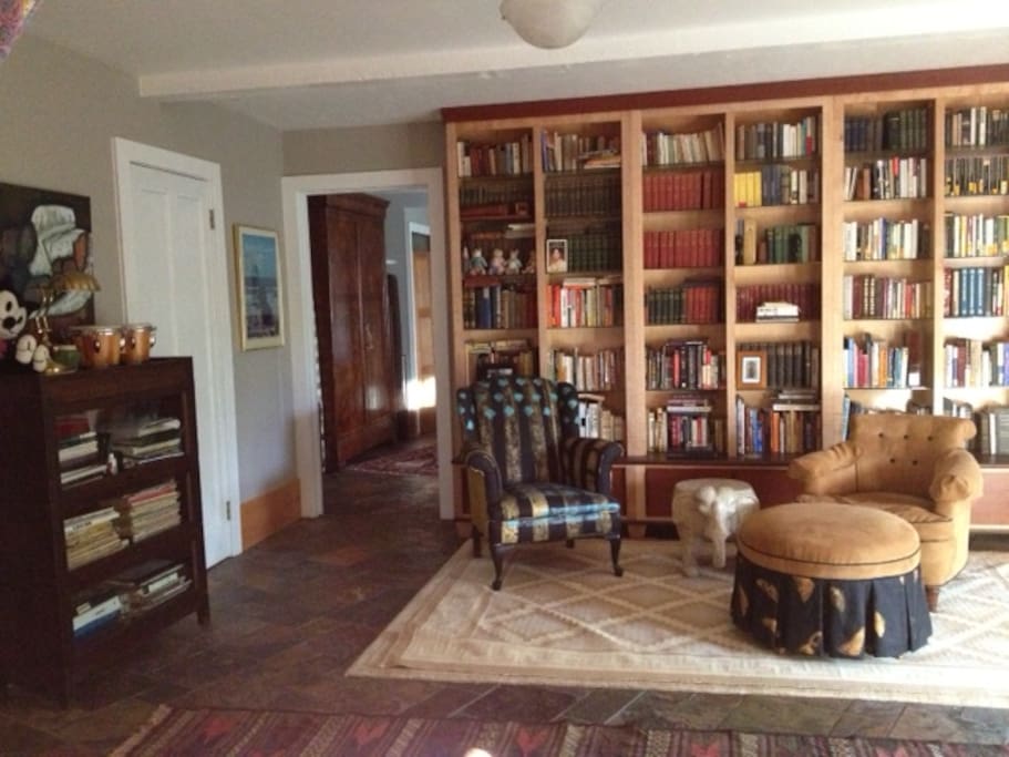 This spacious library entry comes in from the brick patio where often an evening can be spend around the fire pit.