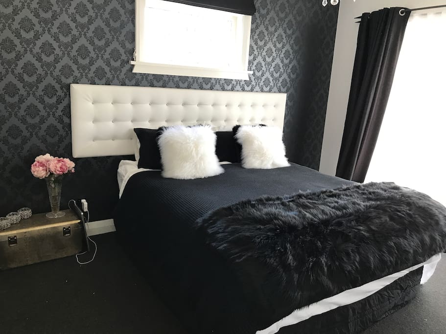 King bedroom with french doors to private deck