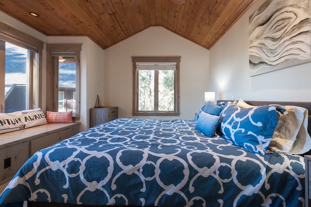 Master bedroom with king bed and sitting area with lake views!