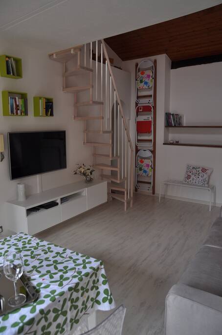 Living room, TV, DVD Player, stairs to the mezzanine