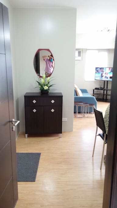 Living room view from entrance with credenza.