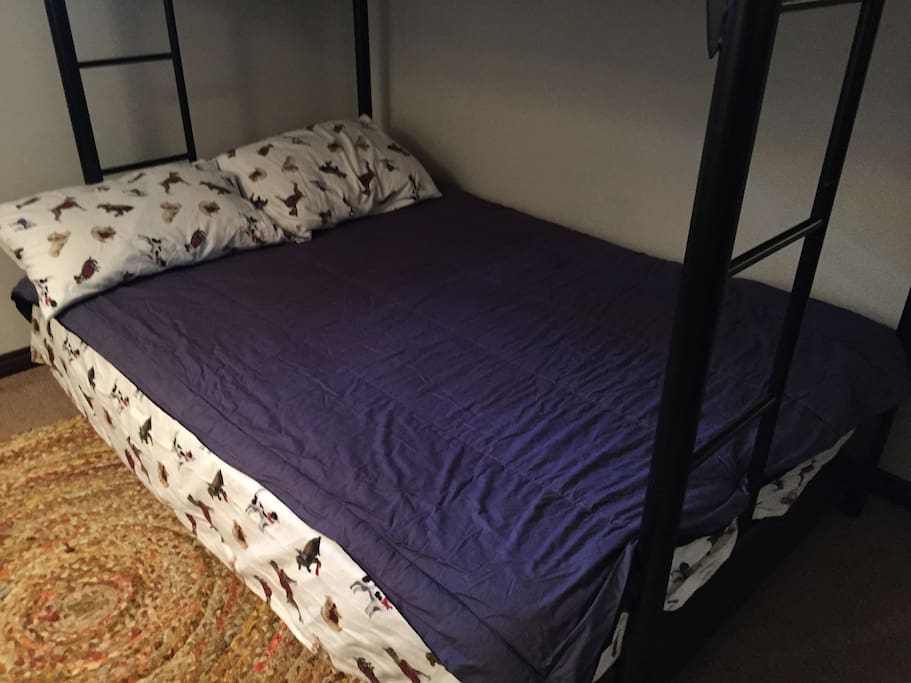 A bed with a memory foam topper for added comfort.
