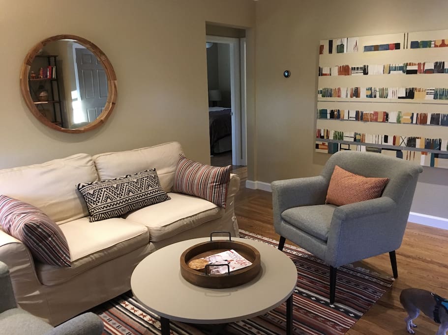 Cozy living area with great modern original art fills with morning sunlight.