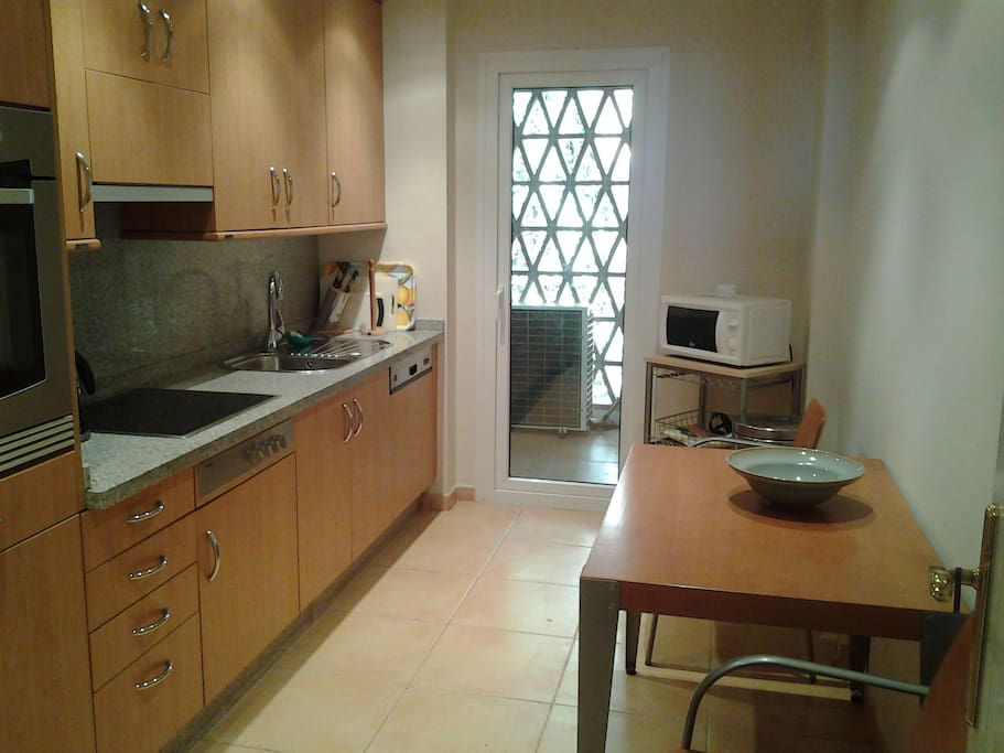 Fully equipped kitchen and utility room.