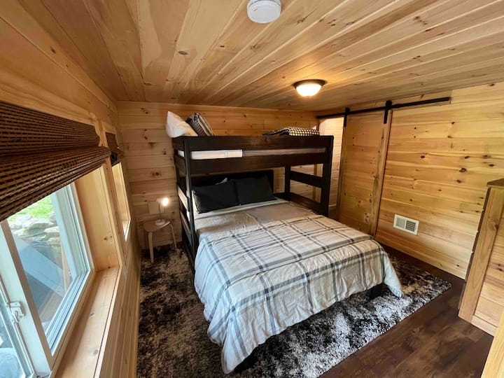 Queen bed with twin bunk above it. Top bed is best for a child, but I’m 5’ 11” and find myself sleeping there sometimes as well!