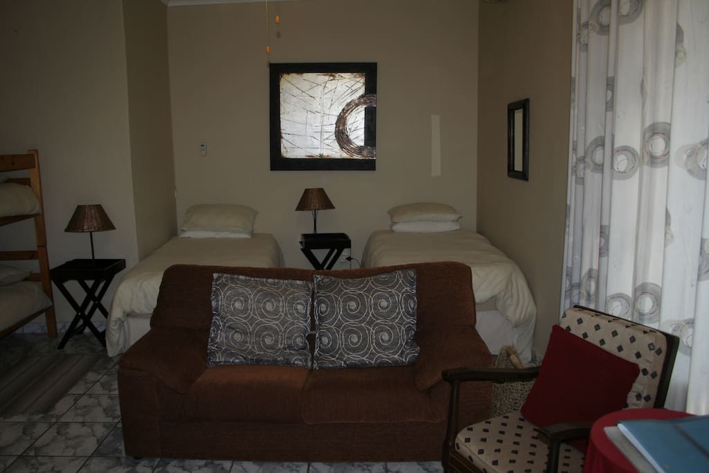 Family room 2 single beds convert into king bed, bunk beds for children, en-suite shower and kitchenette open plan room