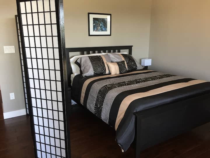 New queen bed in main suite.
