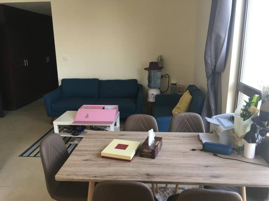 The Room: Master bedroom with a double bed, sitting area, dining area, side tables, 2 big windows with Marina view