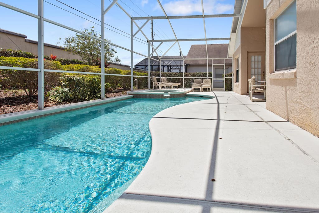 The pool and deck area at this spacious vacation home is a great area to relax and take a dip after a long day at the area theme parks.