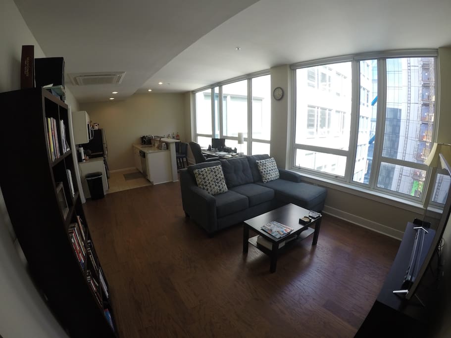 New sofa/chaise and 60 inch 4K TV for relaxing after a long day of business or sightseeing.