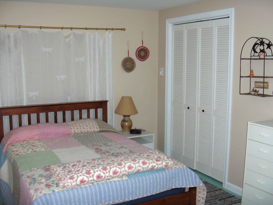 The lower bedroom with queen size bed and a separate entrance