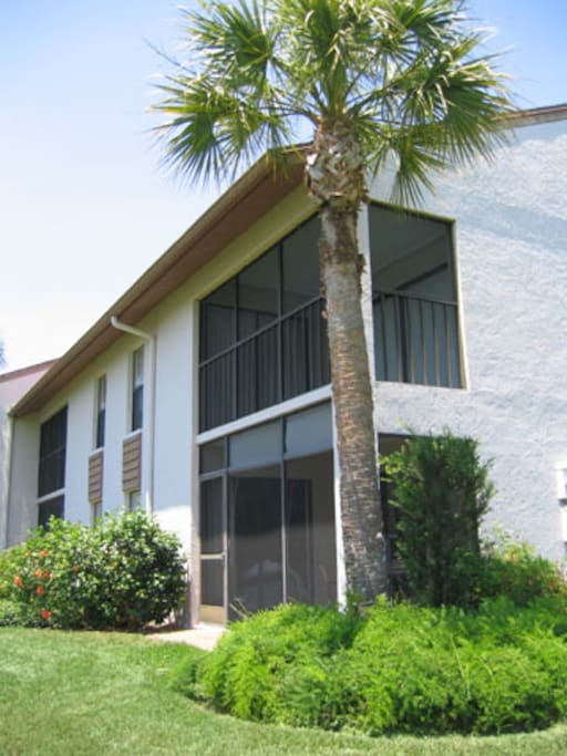 Screened in rear lanai with view of water and golf course