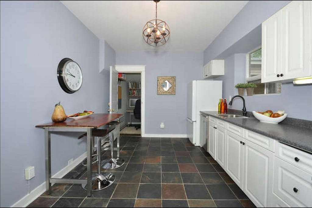 Dishwasher, fridge, gas stove, all cookware for some serious cooking. You can see the back office in the background.