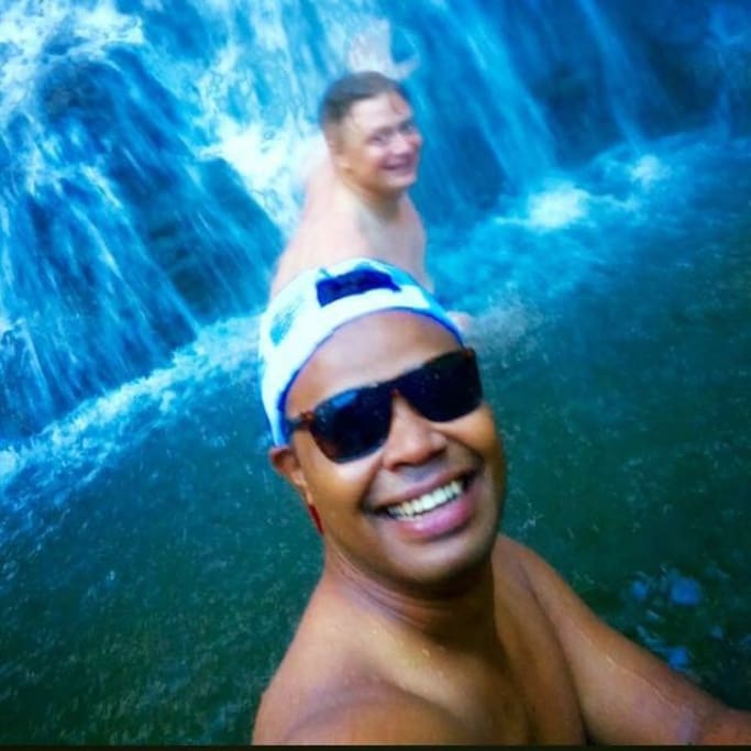 Cooling off at the waterfall after a one hour hike up