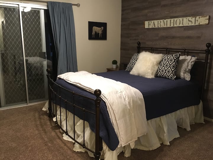 MasterBedroom with access to balcony through patio door. Top of the line pillow top mattress and fine linen. Sheets are organic cotton. Views of hill side from window