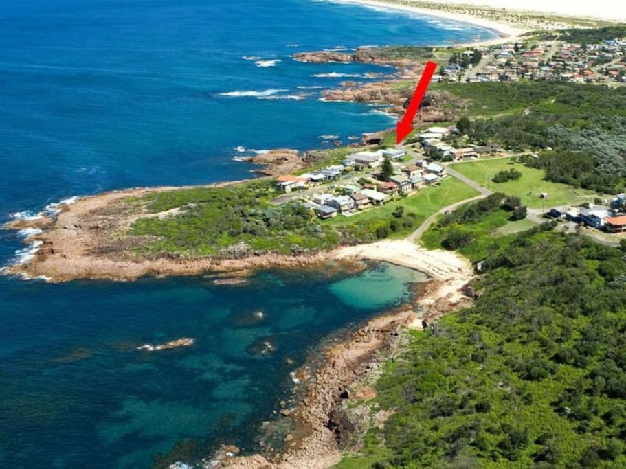 Aerial view of Fishermans Bay with our house marked. As you can see we are surrounded by the Pacific Ocean and Tomaree National Park.