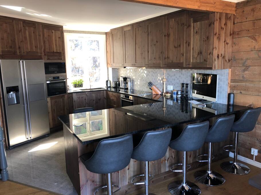 Full kitchen w/ double oven, micro, etc. granite countertops (locally sourced) Cabinets are repurposed from 150yr old original wood floors
