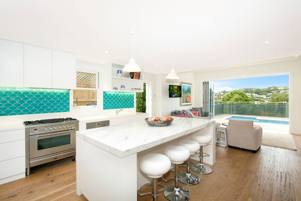 Immaculate renovated kitchen with casual living and dining areas adjoined
