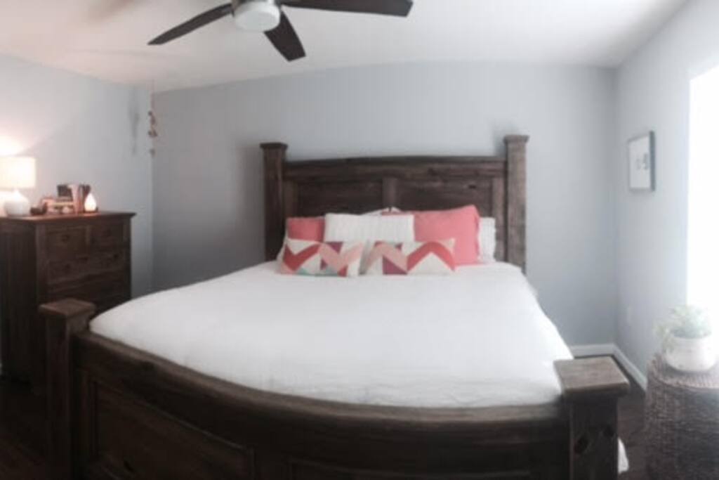 King size bed in one of two bedrooms. This bedroom has a door to the screened in porch and a shower in it's bathroom which is attached.