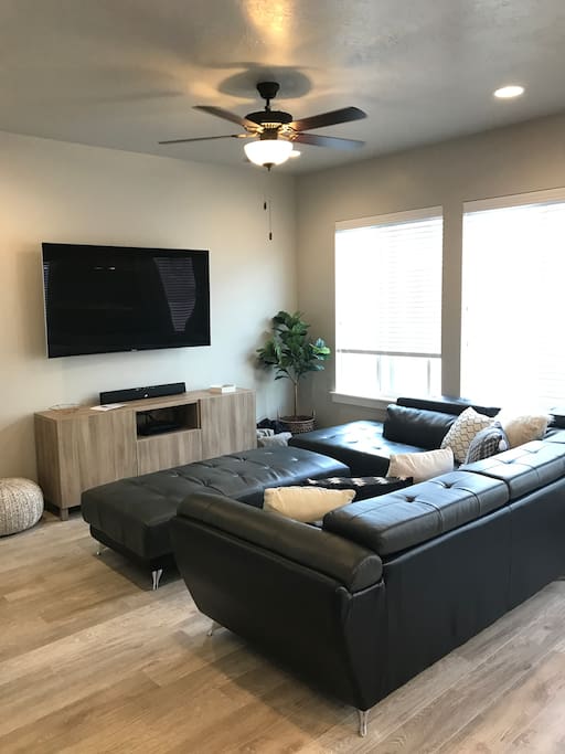 Living Room: 65" 4K curved TV with DirectTV