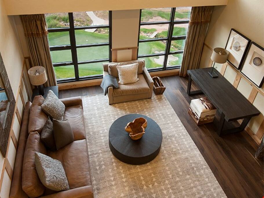 Enjoy vaulted ceilings and beautiful floor to ceiling windows with mountain views