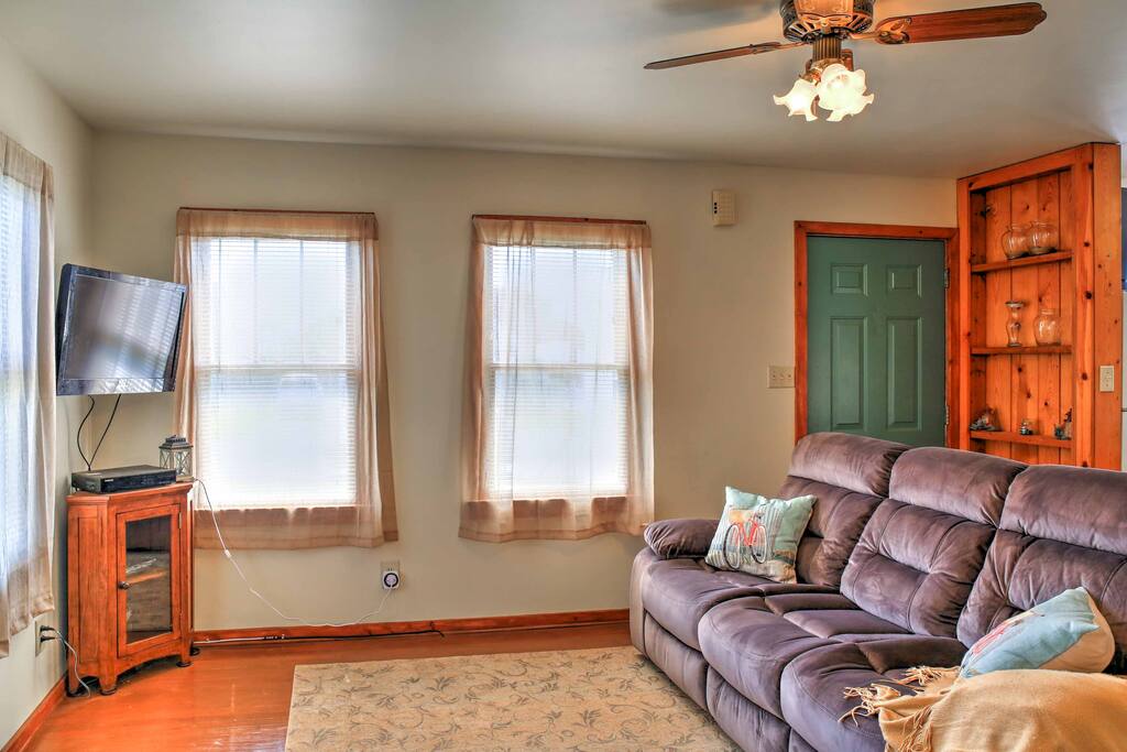 The plush couch is the ideal place to watch your favorite programs on the flat-screen TV.