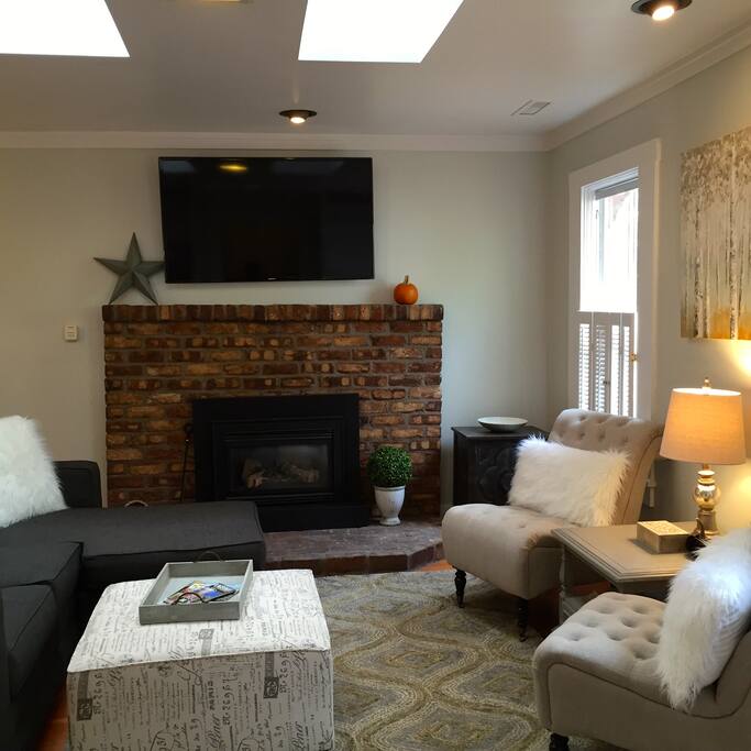 Living room with wonderful natural light from the skylights and plenty of space for everyone!