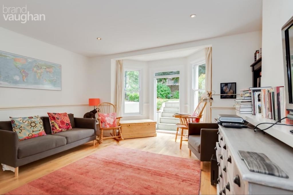 Large sitting room with views to garden and Sky TV