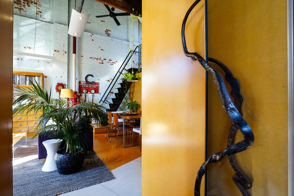 View from entry door with custom iron handle