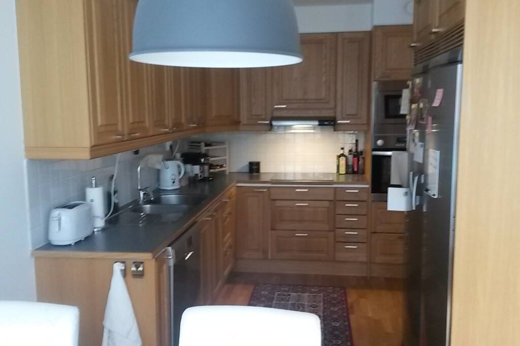 Kitchen with dinner table in foreground
