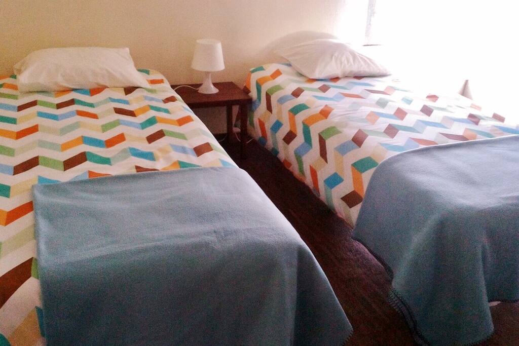 The twin room has lots of sunlight. We recently installed new beds and matresses to better the experience to our guests.