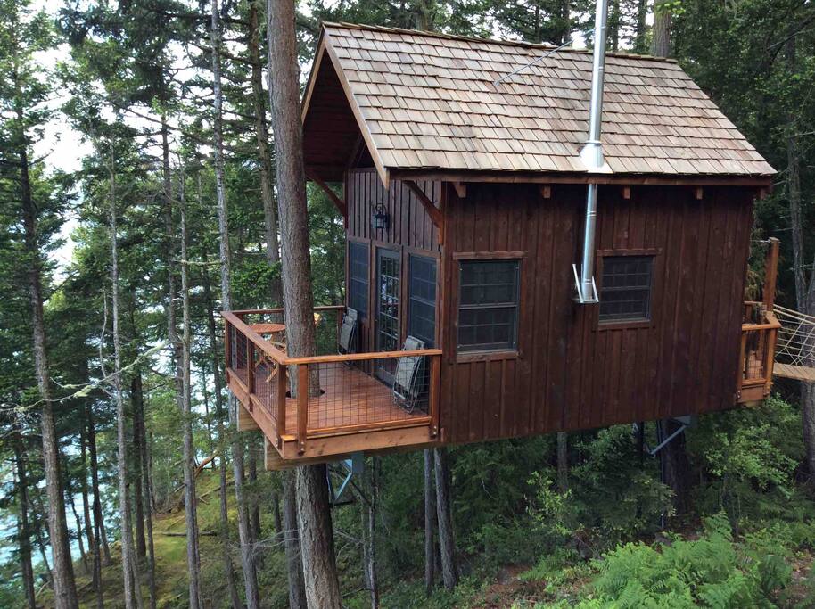 Nestled in the trees between two Douglas Firs, the view includes neighboring Shaw and Orcas Islands and all the marine traffic and wildlife in between.