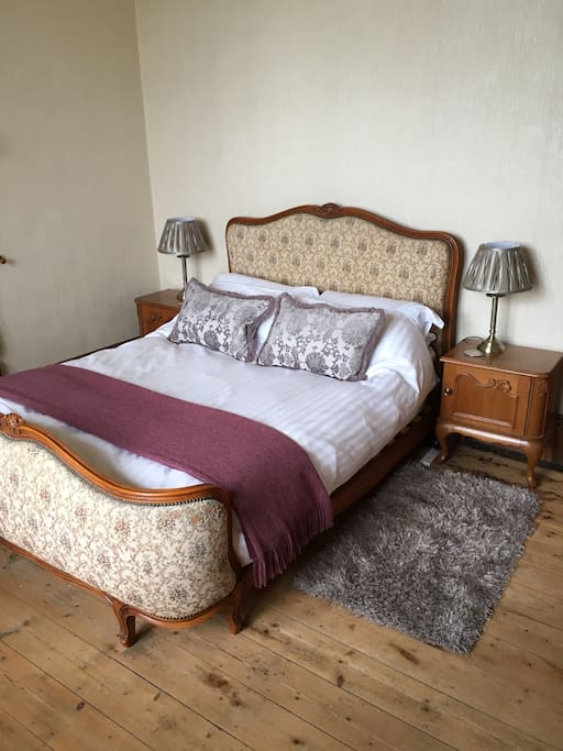 Stripped pine floor and soft rugs