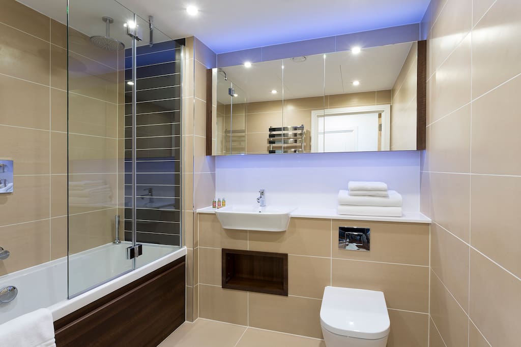 Spotless Bathroom with designer toiletries and power shower