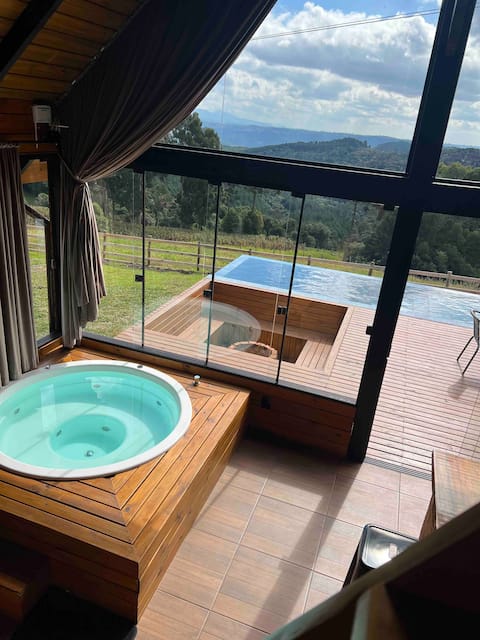 Chalet with Jacuzzi and heated pool