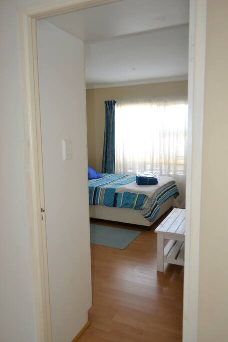 Entrance to single-bed guest bedroom from inside the main house