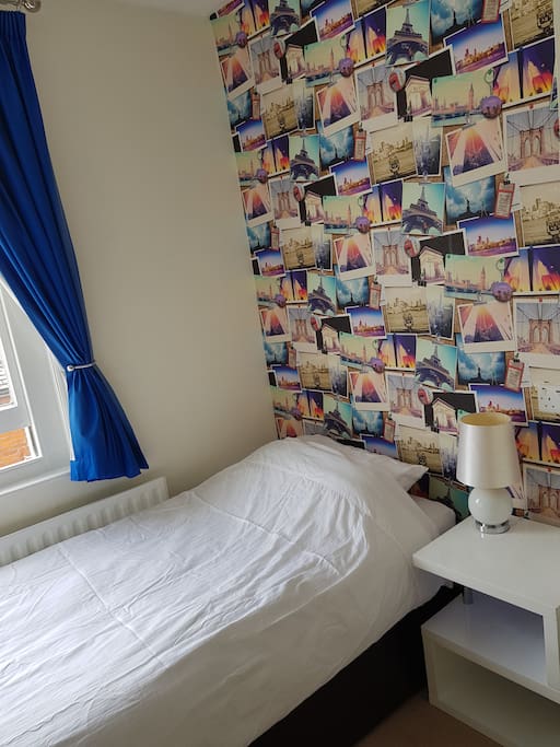 Bed with table and USB charger plug socket