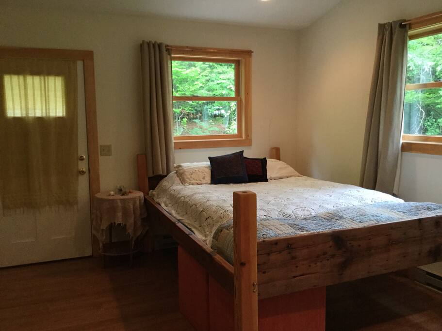 Private entrance door is seen here. This door opens to the deck in the back of the house. Comfy and clean queen sized bed with linens.
