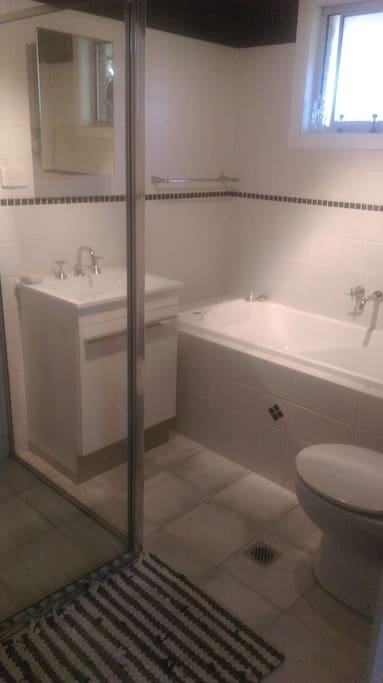 Bathroom with separate shower and bath.
