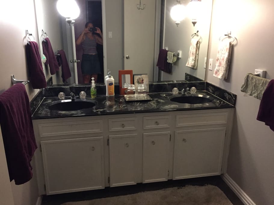 Spacious private bathroom with double sink and vanity.