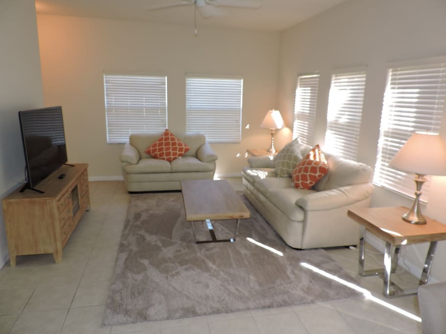 Beautifully furnished with leather sofas.