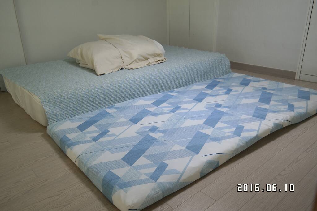 There are extra cushion that can be used for bed.