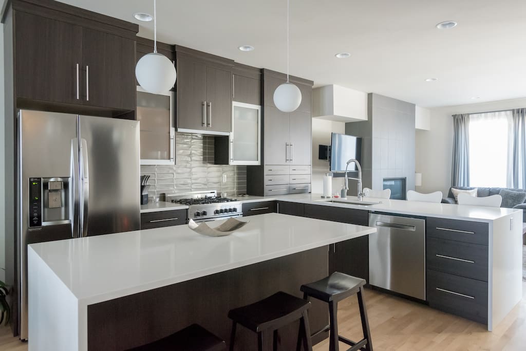 Kitchen view; includes door-in-door refrigerator with water and ice dispenser.
