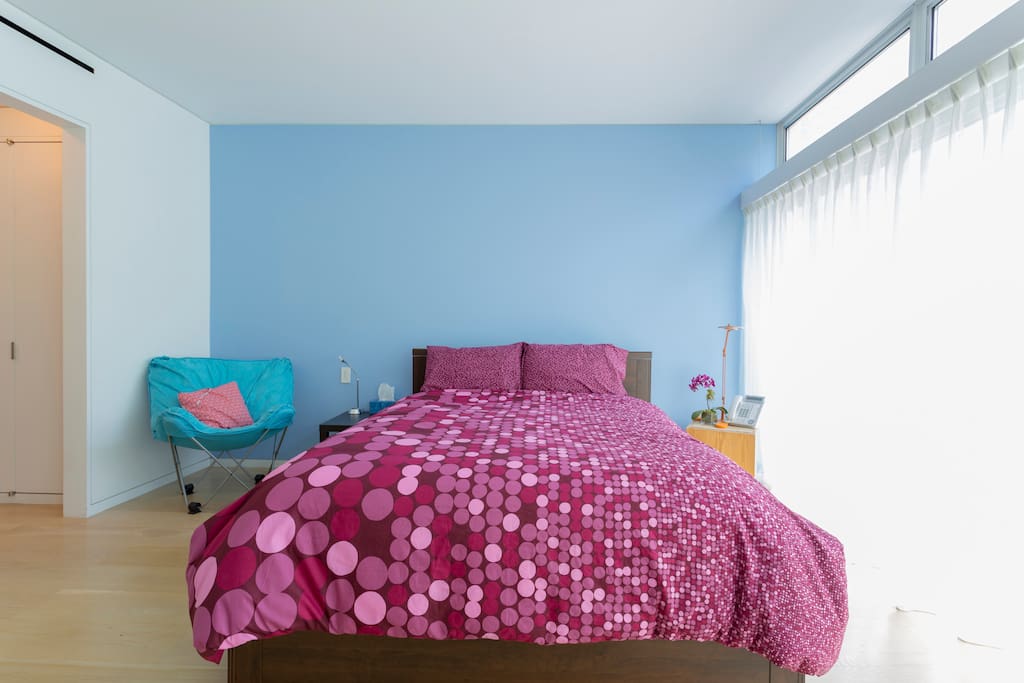 The room is very spacious and catches tons of light from the floor to ceiling windows.